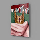 Yawning Cat in Bed Glass Wall Art