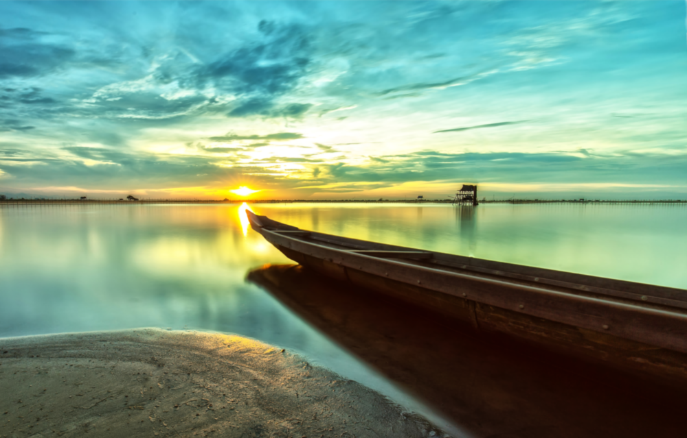 Kayak on the Beach and Sunset Glass Wall Art